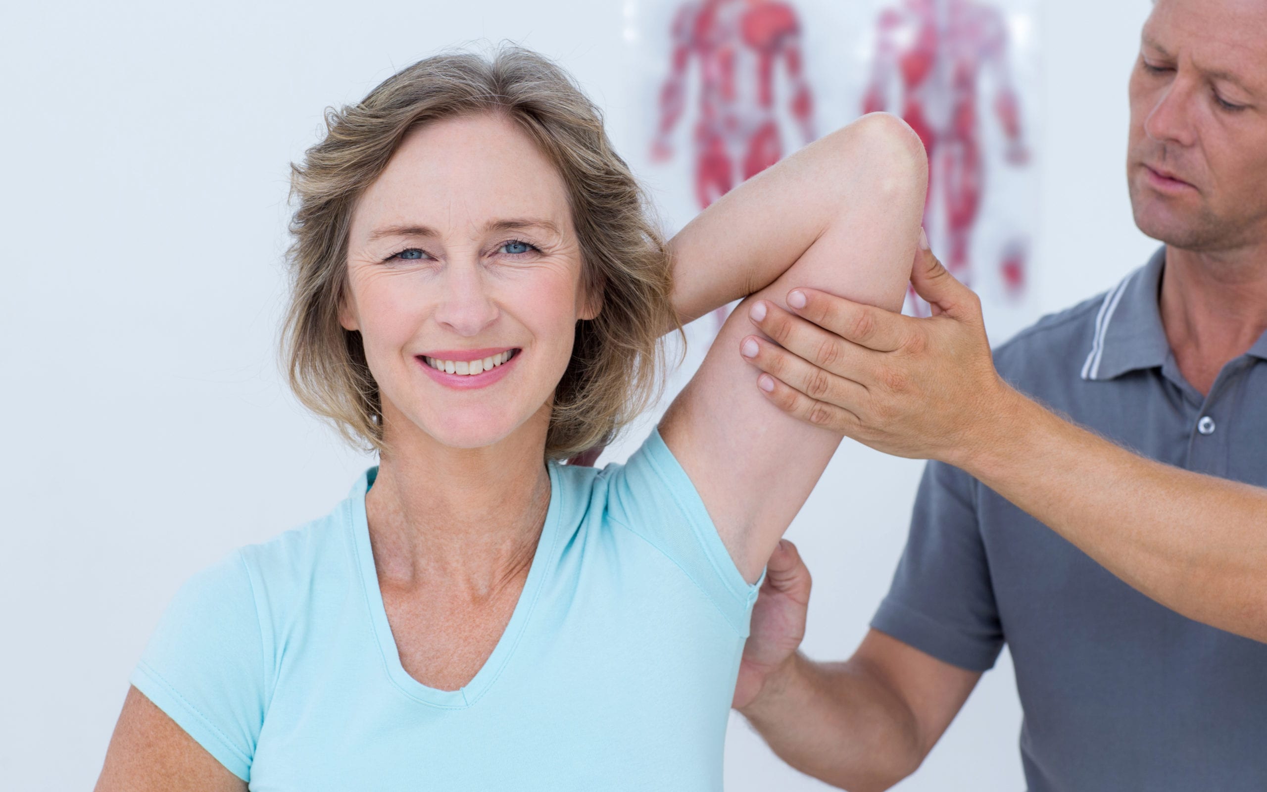 Physical therapist helping patient 